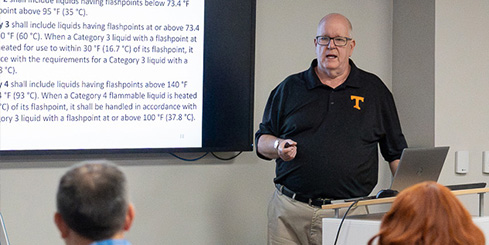 A man teaches an OSHA training in a classroom.