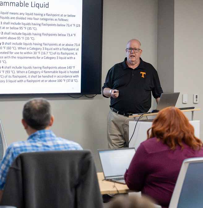 CIS's Bryan Lane teaches an OSHA seminar in a classroom.