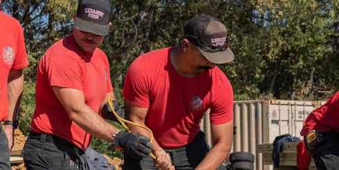 Two first responders work at a trench rescue training.